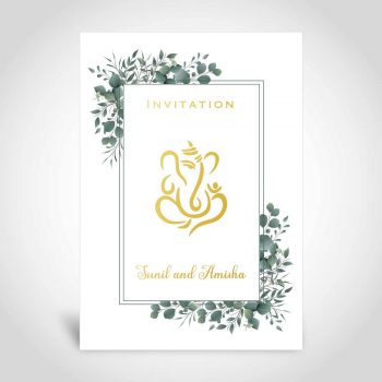 An Indian wedding card with gold foiling and a leaf border