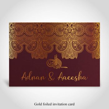 Dark red Muslim wedding card with gold foiled Ganesh and bride and grooms names