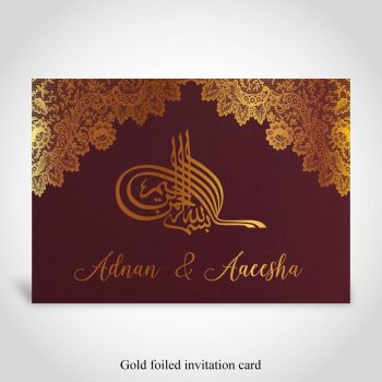 Pakistani wedding card, gold foiled on dark red card
