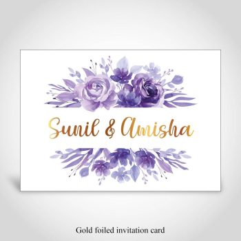 Purple floral Hindu wedding invitation card with the names of the couple foiled in gold