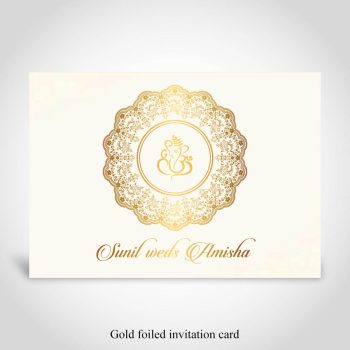 Gold foiled floral frame Hindu wedding invite with Ganeshji on cream cardstock